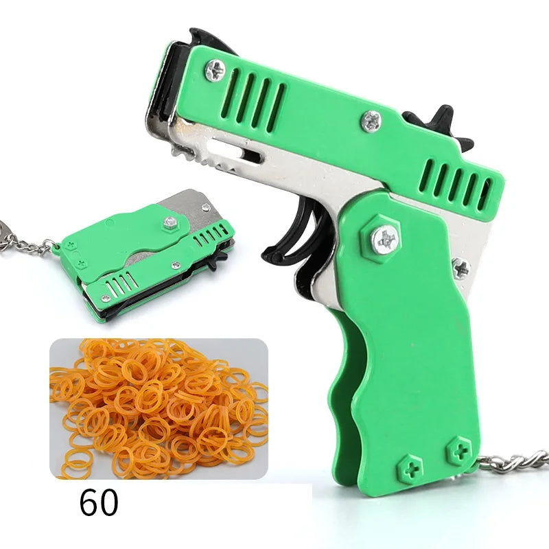 Wholesale Mini Rubber Bands Shoot Gun Alloy Metal Gun Pistol Plastic Key Chain Collapsible Funny Gun Toys For Kids