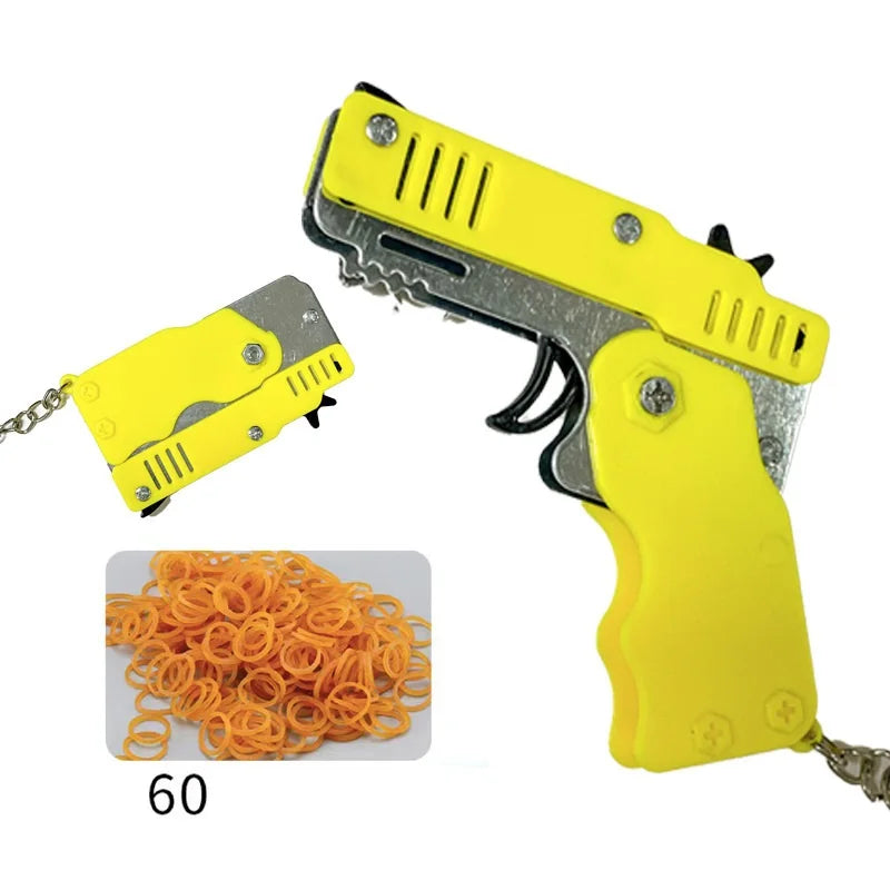 Wholesale Mini Rubber Bands Shoot Gun Alloy Metal Gun Pistol Plastic Key Chain Collapsible Funny Gun Toys For Kids