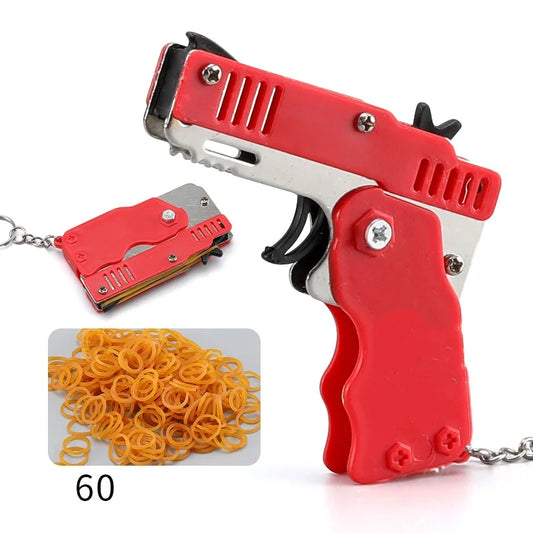 Wholesale Mini Rubber Bands Shoot Gun Alloy Metal Gun Pistol Plastic Key Chain Collapsible Funny Gun Toys For Kids